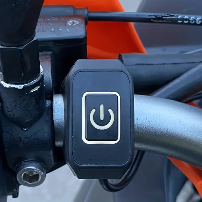 Bouton de commutation universel pour guidon de moto